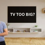 A man thinking can a TV be too big for his room?